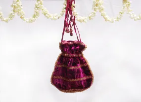 Dark pink velvet potli with gold jari embroidery